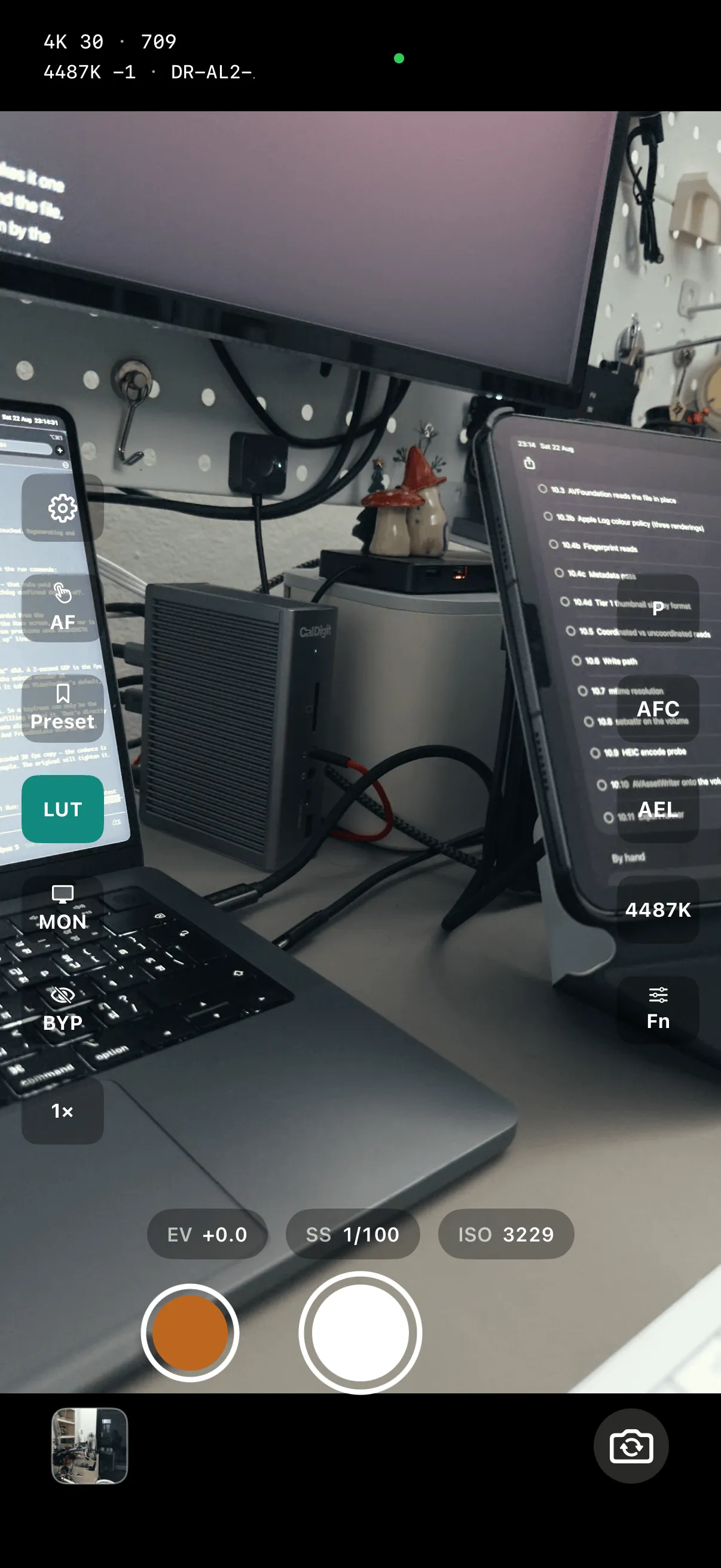 Memios camera: live graded Apple Log preview with the AF, Preset, LUT, monitor and bypass controls, the EV / shutter / ISO readout, and the record and photo shutters